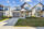 the street view of a house with a garage